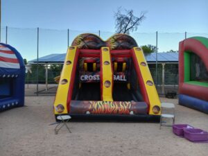 Large inflatable basketball shootout game set up in Buckeye AZ with teens and adults competing for the high score.